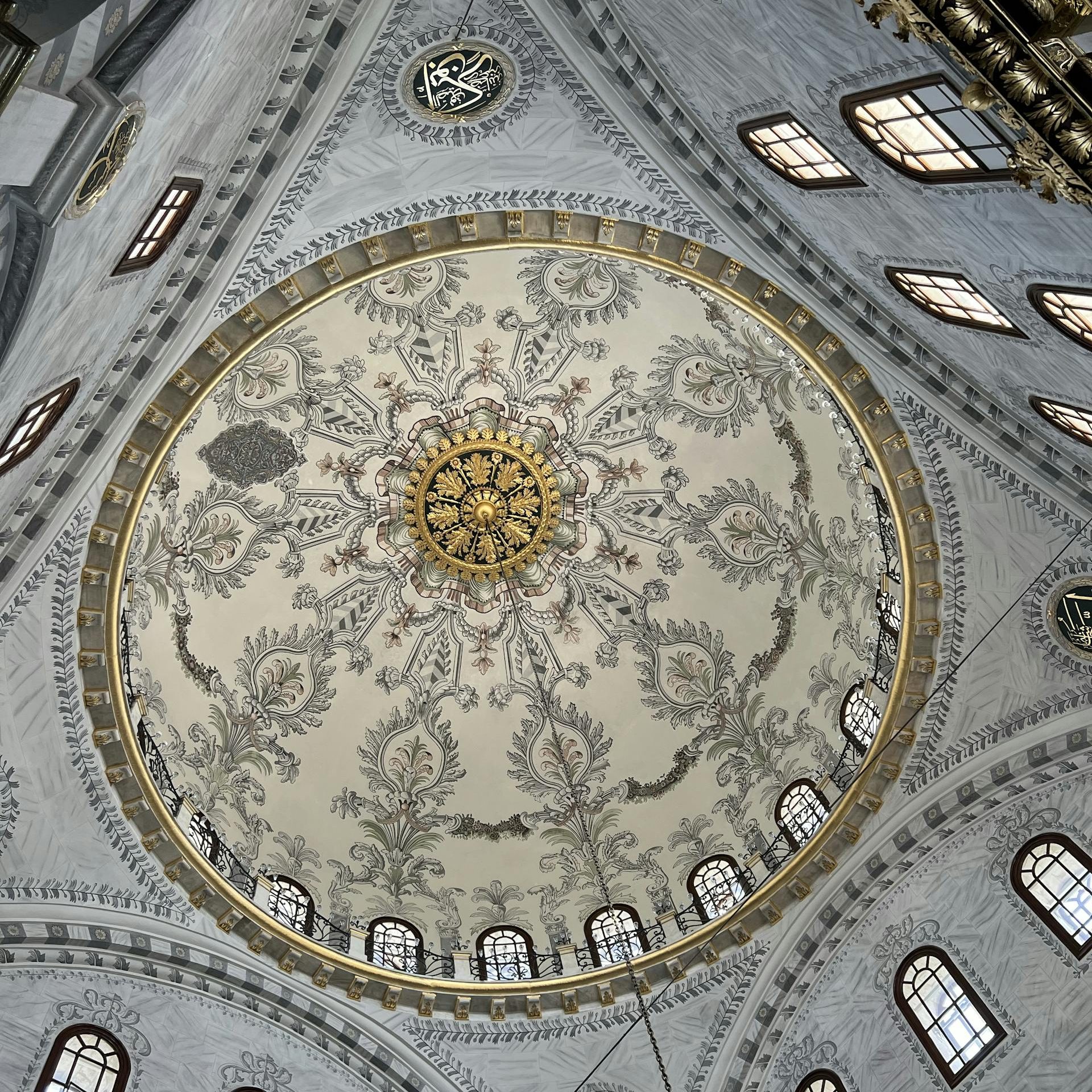 Captivating interior view of a beautifully decorated mosque dome in Istanbul.