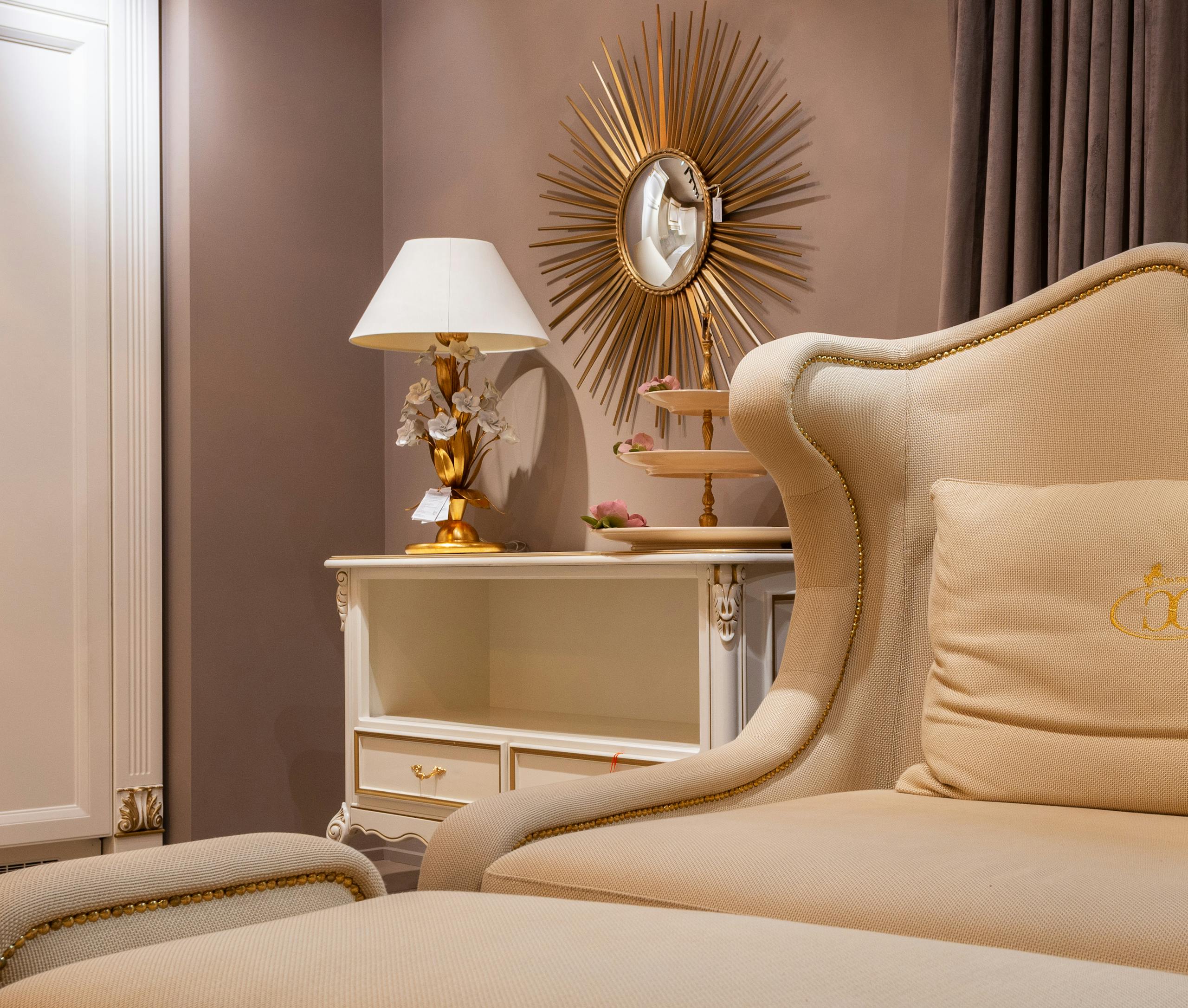 Cozy classic room with elegant decor featuring beige furniture and gold accents, creating a warm and inviting atmosphere.
